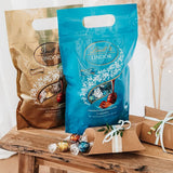 LINDOR čokoládové kuličky se slaným karamelem | cca. 80 kuliček z mléčné čokolády s náplní ze slaného karamelu | Bulk Pack & Marc de Champagne Čokoládové kuličky | 700 g