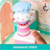 DOMEČEK PRO PANENKY GABBY'S DREAMWORKS - Pokoj Deluxe, Cukrárna Cakey, Kuchyňka Kuchi (rumunsky Cakey), 3 kusy nábytku a 2 krabice s překvapením s příslušenstvím, vhodné pro děti od 3 let