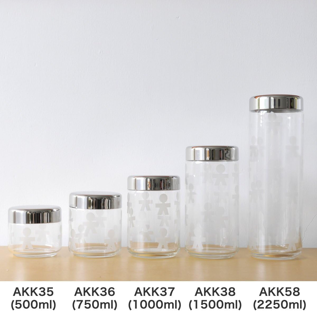 Alessi AKK37 GIROTONDO Skleněná kuchyňská dóza s potiskem a utěsněným nerezovým víčkem, L 21,6 cm, V 10,5 cm Dózy na potraviny Naty Shop