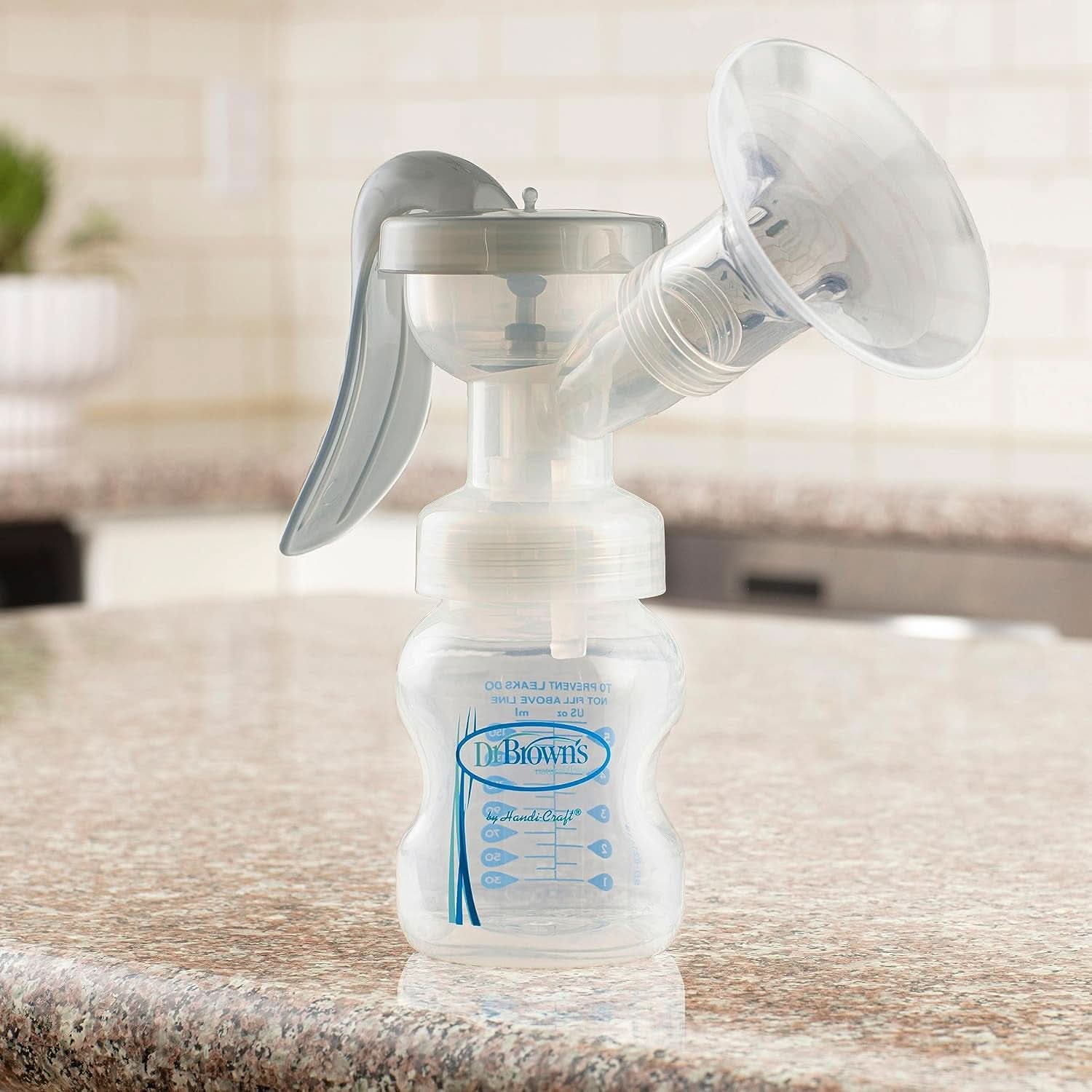 Manuální odsávačka mateřského mléka se 100% silikonovou ochranou Softshape (B, 25mm příruba) a antikolikovými doplňky + 150ml širokoúhlá láhev se savičkou úrovně 1 s pomalým průtokem Příslušenství Potraviny a kojení Bebe Naty Shop