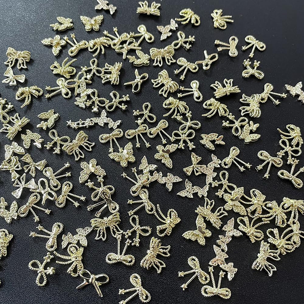 50Stück 3D zlatá mašle na nehty Butterfly Nail Art Charms Legierung Bogen Nagel Charms Nägel Zubehör Schleife Nagelschmuck Metall Schleifen Schmetterling Nageldesign Nagelanhänger Nailart Strasssteine