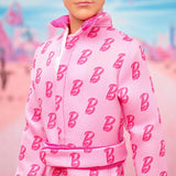Barbie The Movie - Ken-Sammelpuppe, Ryan Gosling a Ken v růžově obarvené kombinéze s "B"-Aufdruck, bílými teniskami a barevnými bruslemi, JCP80