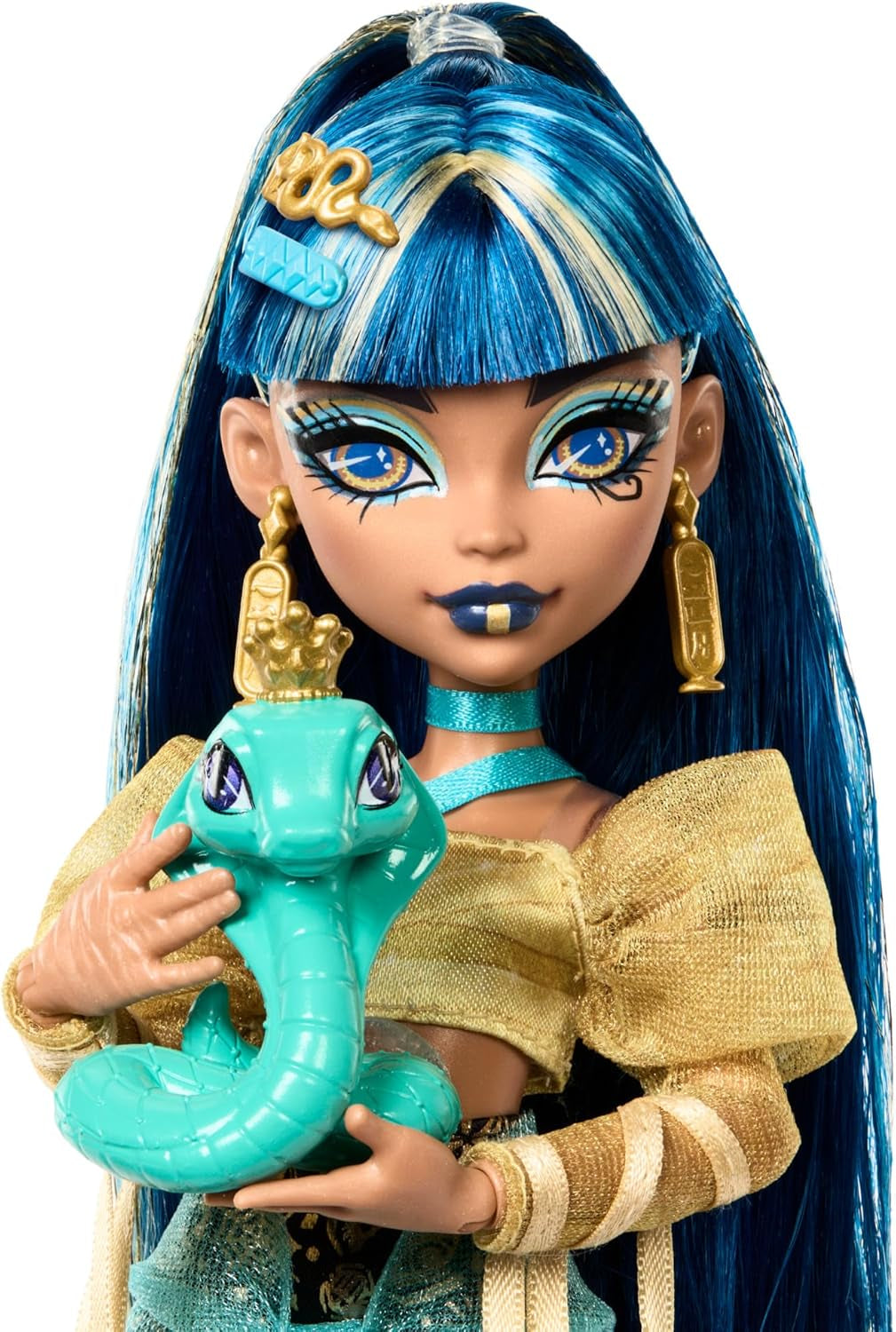 Panenka Monster High Cleo De Nile ve zlaté halence a vrstvené sukni, obsahuje kobru Hissette a doplňky, jako je školní taška, svačinka a role toaletního papíru, HXH74