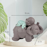 Socha Zen'Light Buddha Bonze Spící na slonovi - Zenová atmosféra ve vašem posvátném prostoru - krásná příznivá postava -V 9,5 cm, Hnědé a zelené Sošky a sochy Naty Shop