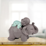 Socha Zen'Light Buddha Bonze Spící na slonovi - Zenová atmosféra ve vašem posvátném prostoru - krásná příznivá postava -V 9,5 cm, Hnědé a zelené Sošky a sochy Naty Shop